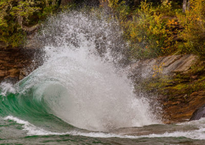 Waves curl and crach into cliffs in Lake Superior near Munising, Michigan, USA